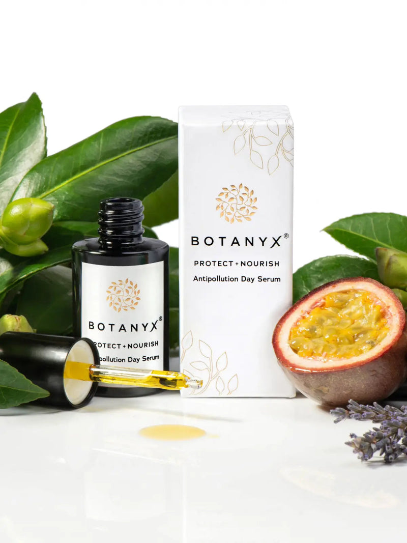 Botanyx skincare product with leaves and a fruit on a white background