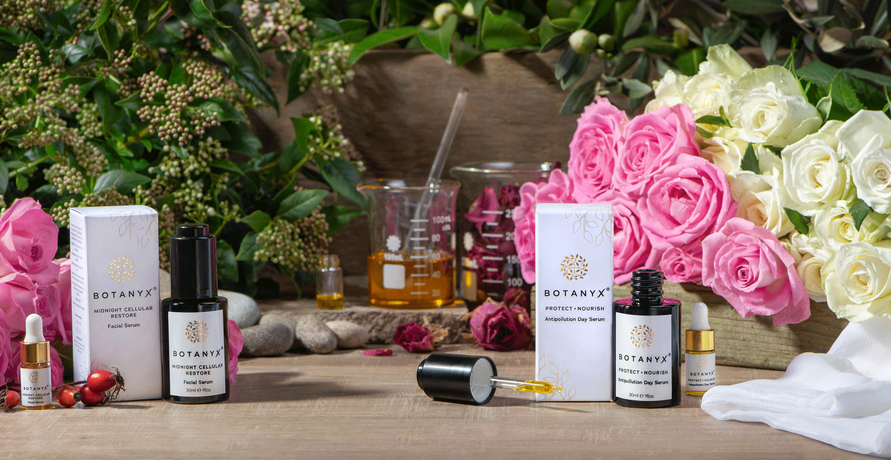 Botany skincare products on a wooden table with flowers in the background